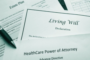A pen rests on documents labeled Estate Plan, Living Will Declaration, and HealthCare Power of Attorney—reflecting the careful guidance of Fears Law founder, recognized by Super Lawyers 2023.